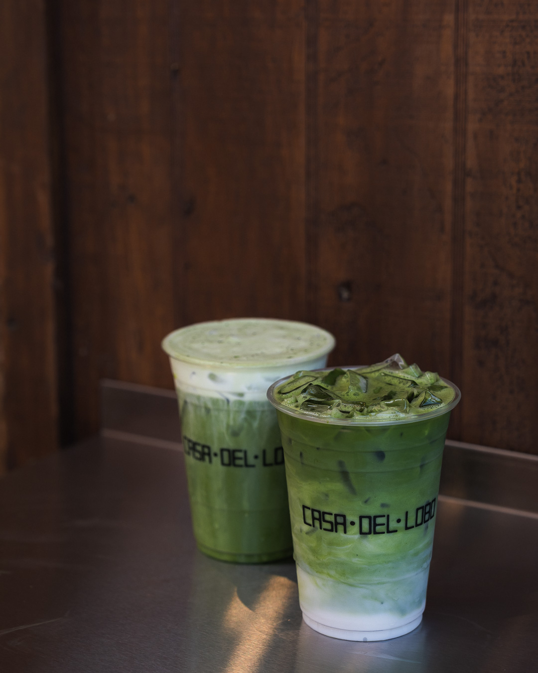 Two matcha drinks in Casa Del Lobo cups